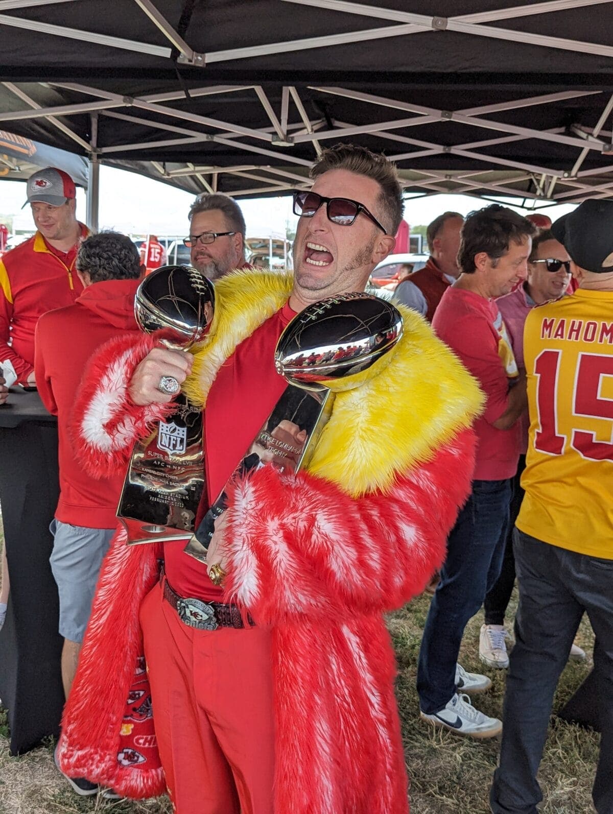 Kansas City Chiefs tailgate celebration with Lombardi trophies under TG Event tent